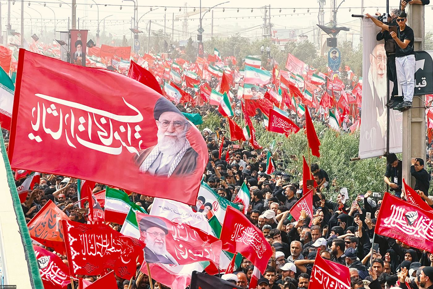 Flags raised over the procession route