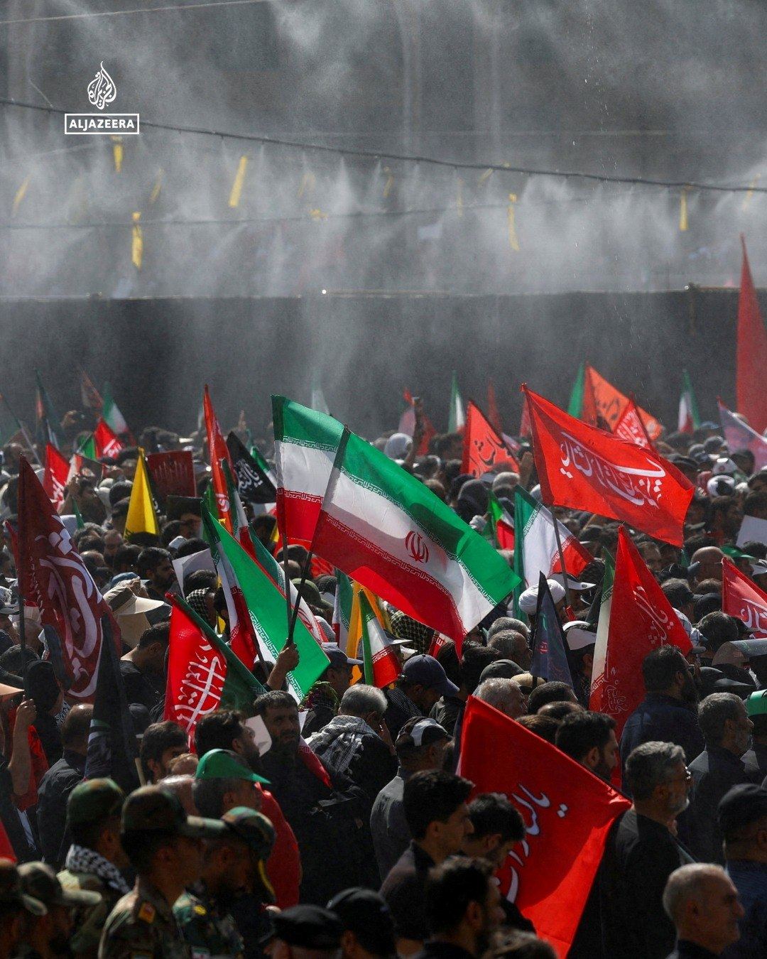 Crowd waving flags